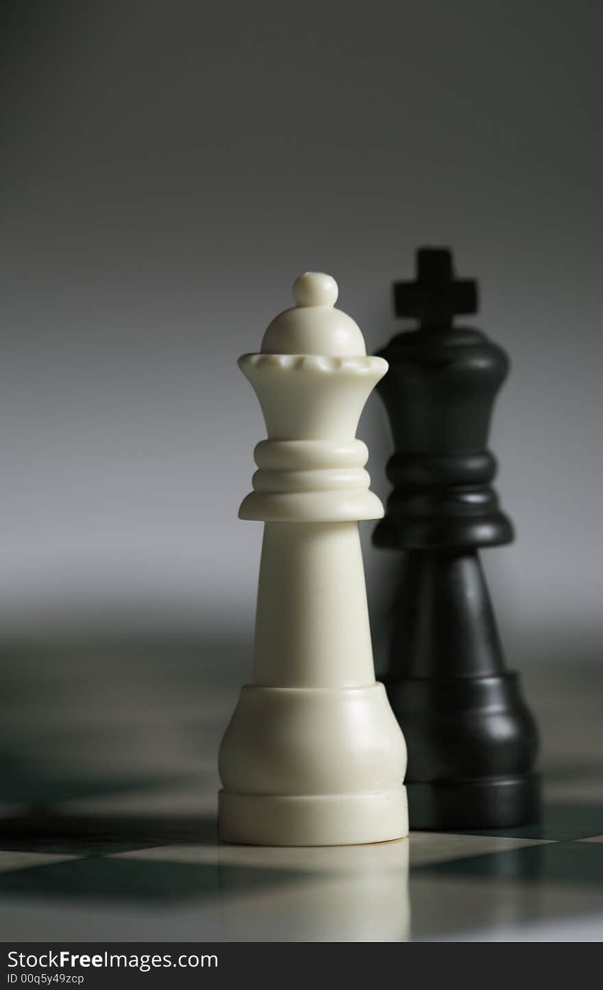 Close up of White Queen with Black King great for a valentines poster or Chess tournament. Close up of White Queen with Black King great for a valentines poster or Chess tournament