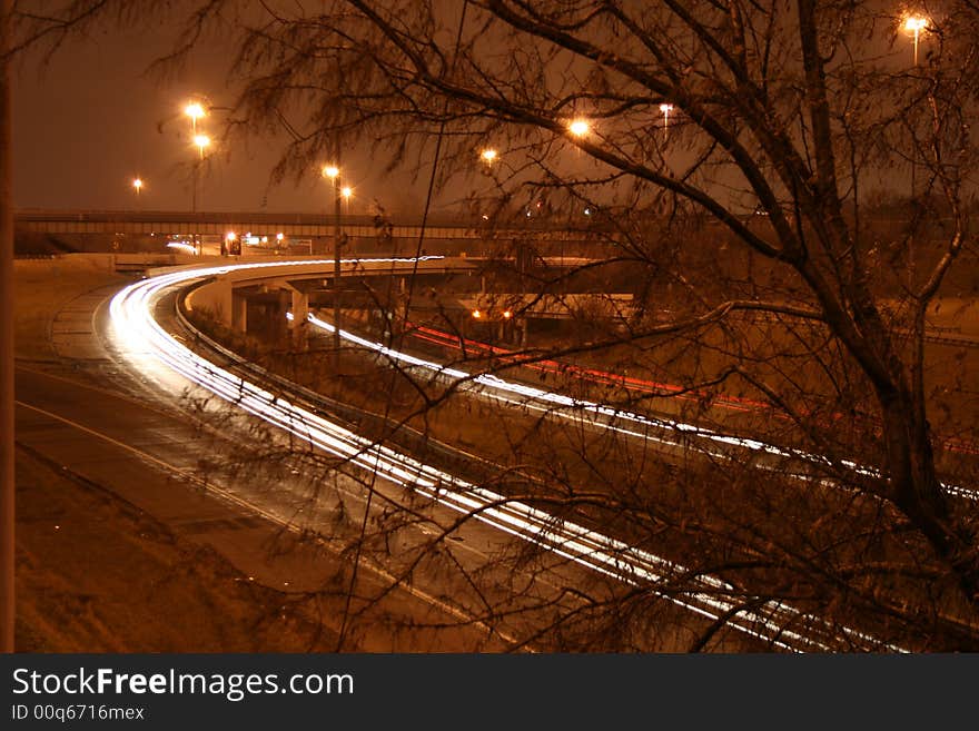 Headlights and tail lights streaking by on a freeway in Ohio. Headlights and tail lights streaking by on a freeway in Ohio