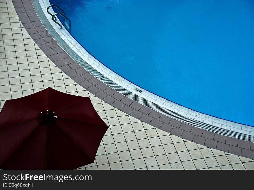 Swimming pool and umbrella in the hotel