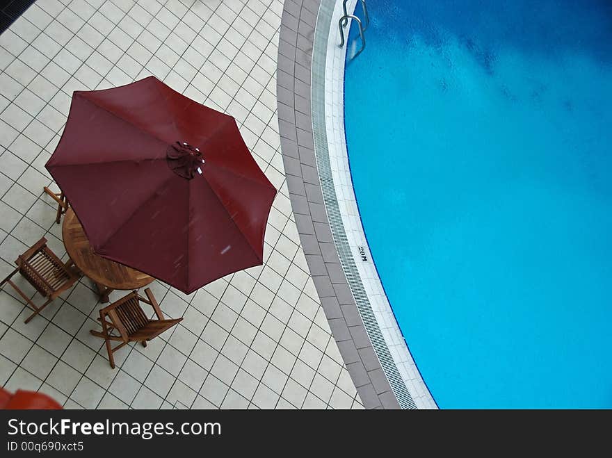 Swimming pool and umbrella in the hotel