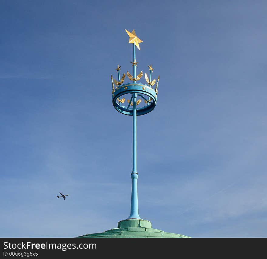 Runnymede Air Forcesl rooftop Memorial against a blue Winter sky with passenger airline flying past. Runnymede Air Forcesl rooftop Memorial against a blue Winter sky with passenger airline flying past