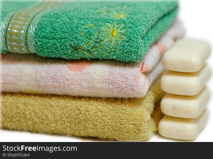 Several folded double towels of different color. Several folded double towels of different color.