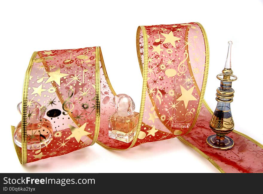 Perfumed gift with golden ribbon. Perfumed gift with golden ribbon