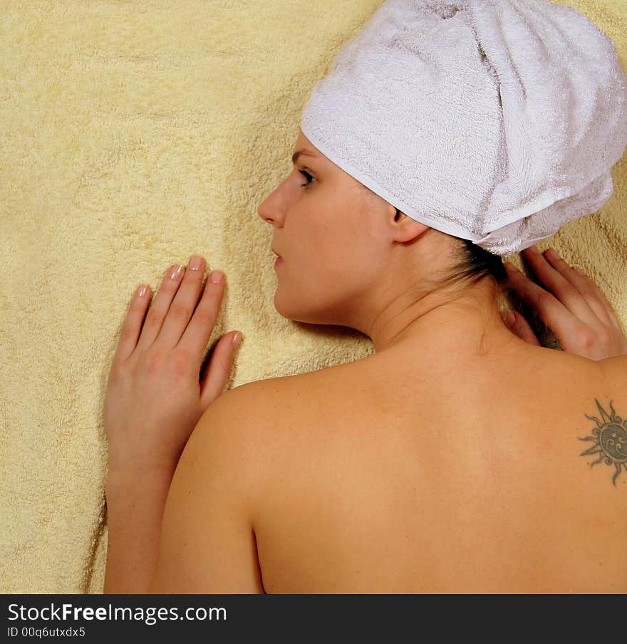 A young woman is enjoying her day in the spa. A young woman is enjoying her day in the spa.