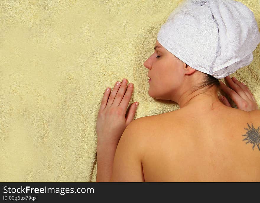 A young woman is enjoying her day in the spa. A young woman is enjoying her day in the spa.