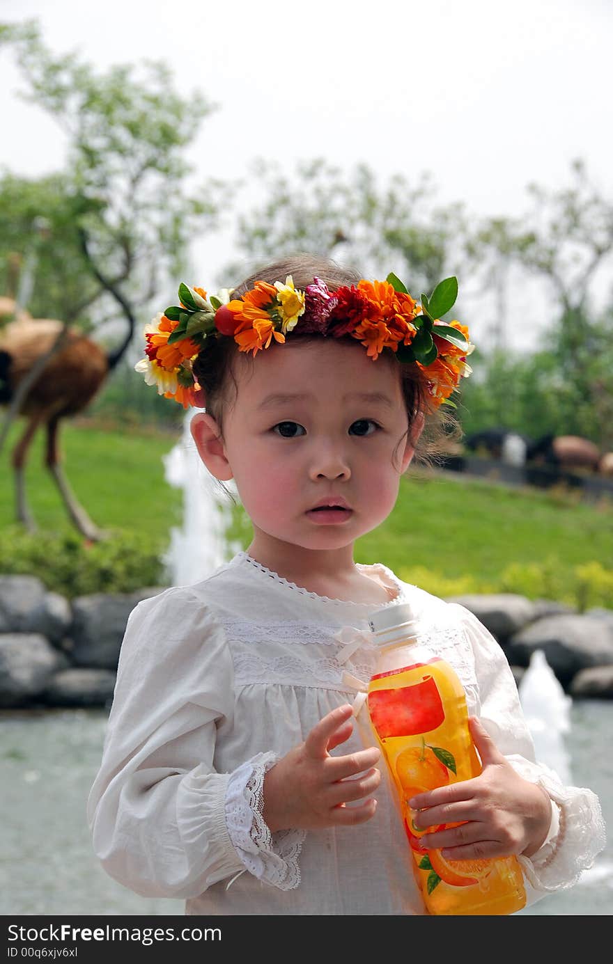 Lovely child with a coronet of flowers