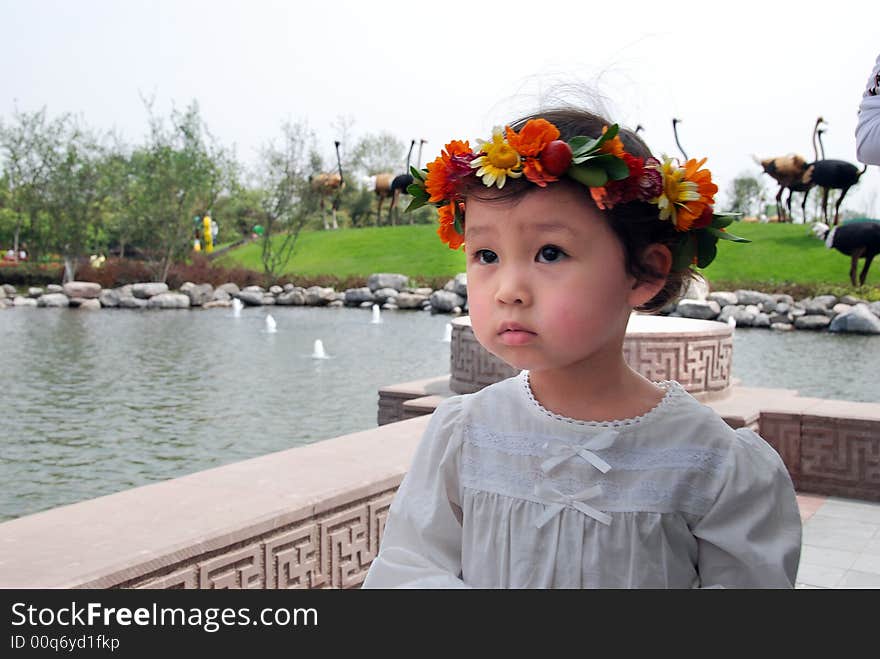 Lovely child with a coronet of flowers