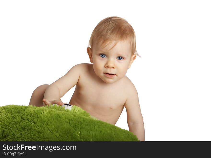 Baby with a green pillow. Baby with a green pillow