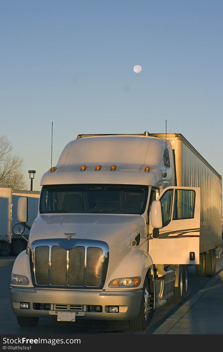 Truck parked under the moon -