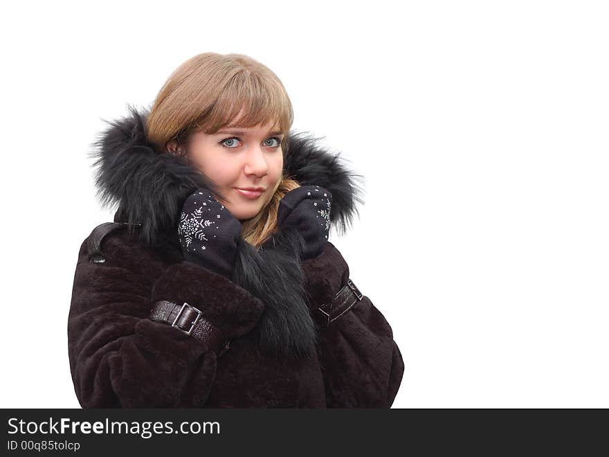 Beautiful girl in a fur coat isolated over a white background