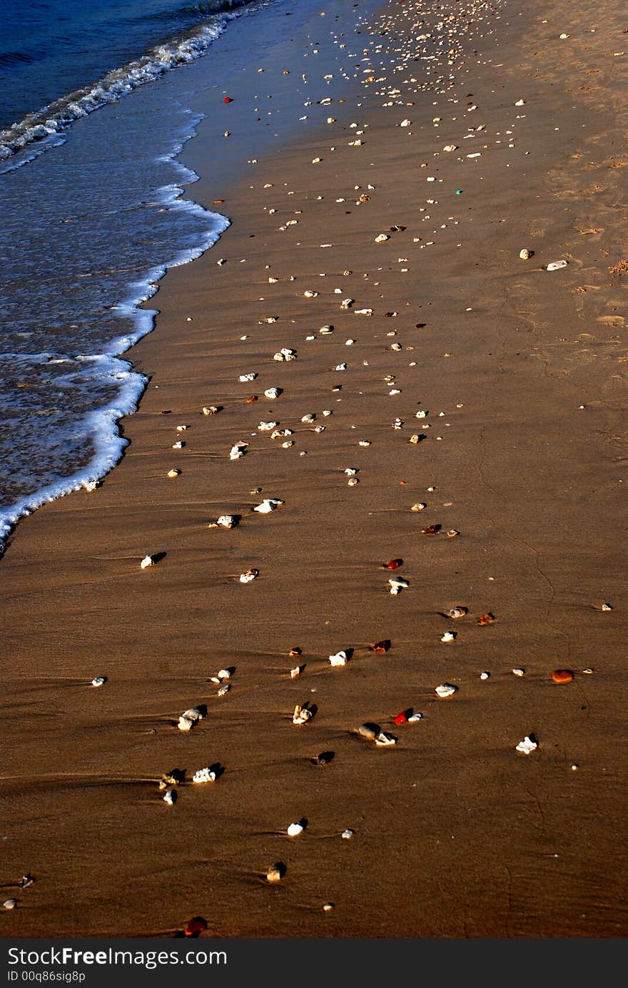 little stones scatter on the beach, Sanya,Hainan,China,asia. little stones scatter on the beach, Sanya,Hainan,China,asia