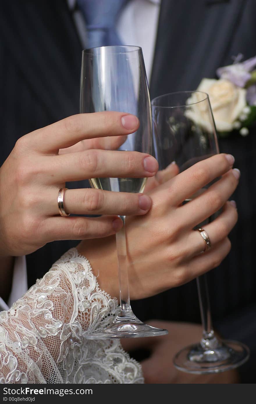 Hands of man and woman with glasses, just married. Hands of man and woman with glasses, just married