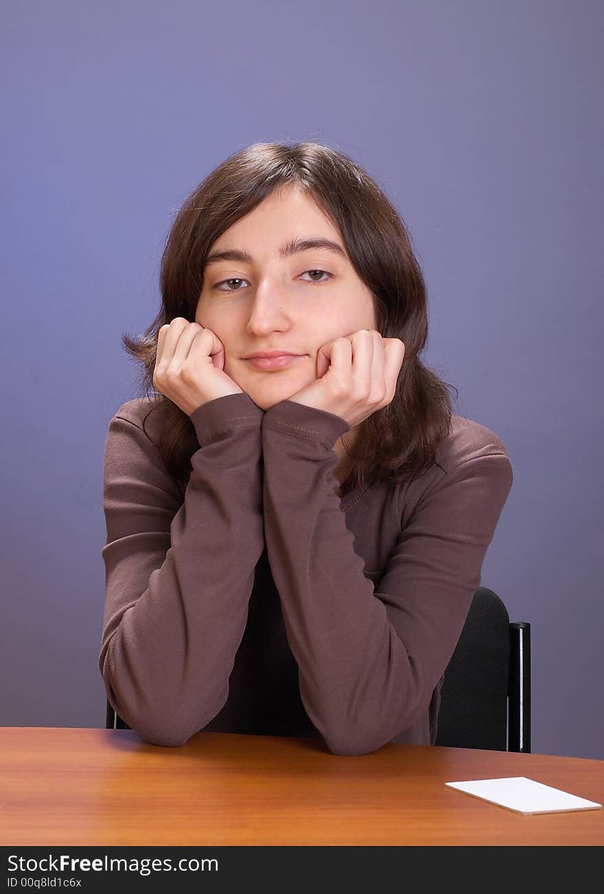 The beautiful girl with a coffee mug on a grey background. The beautiful girl with a coffee mug on a grey background