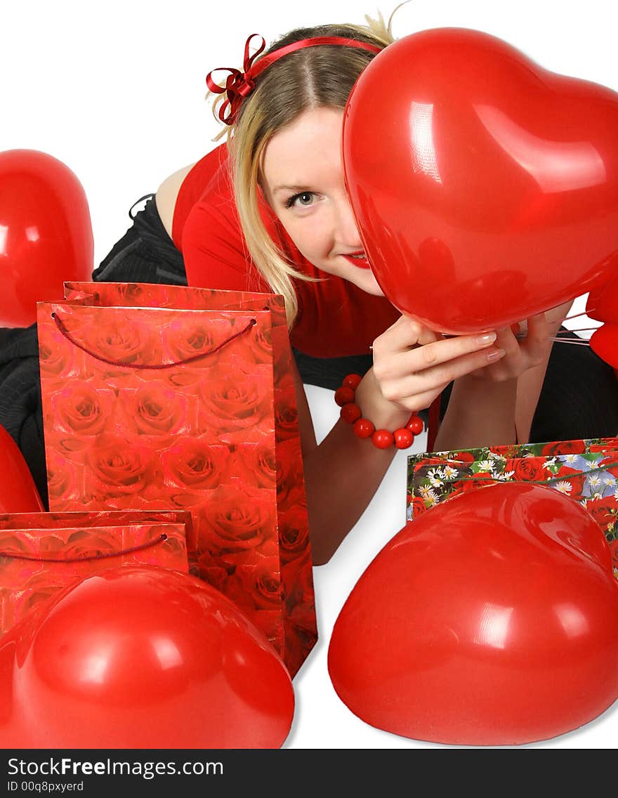 Beautiful blond girl with red hearts and gift boxes