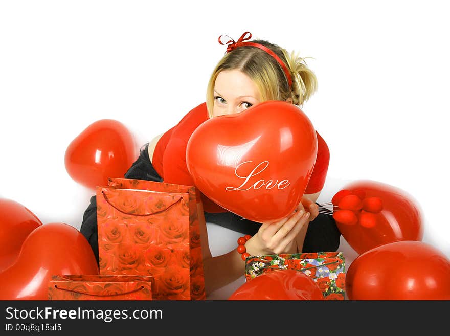 Beautiful blond girl with red hearts and gift boxes