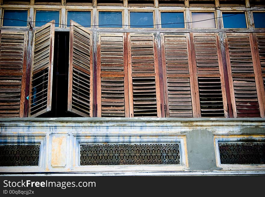 Wooden windows of a heritage building in Penang, Malaysia