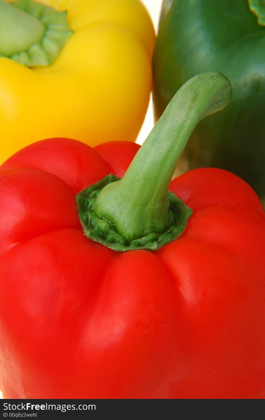 Fresh healthy red,green and yellow peppers closeup