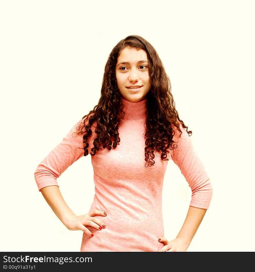 A young girl in jeans and pink sweater for white background. A young girl in jeans and pink sweater for white background.