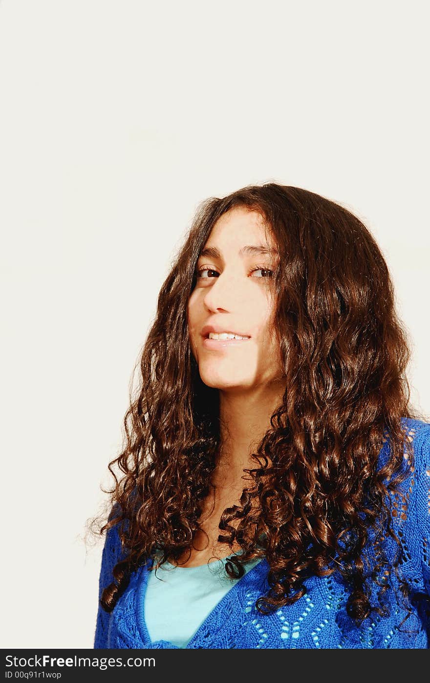 A young girl in jeans and turquoise sweater for white background. A young girl in jeans and turquoise sweater for white background.