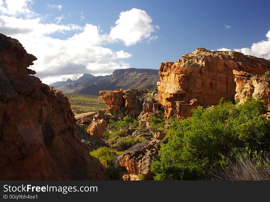 Landscape - yellow- red rocks against mountains