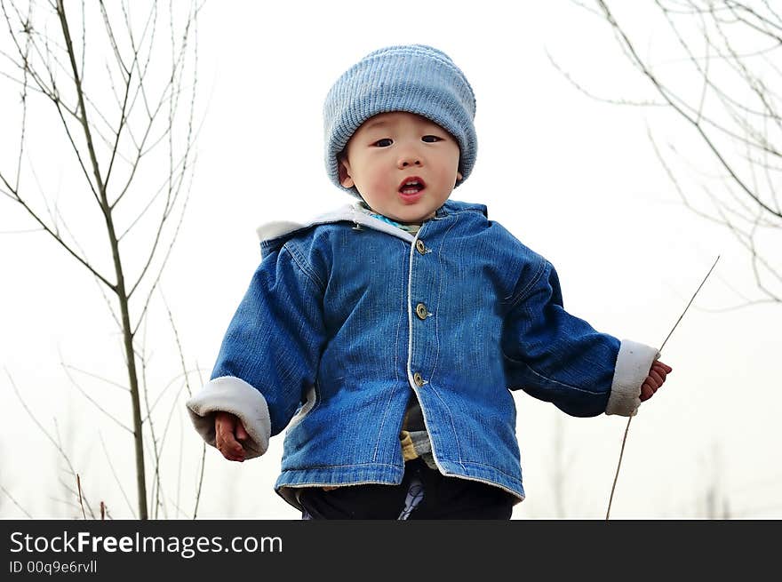 A  baby playing in country. A  baby playing in country