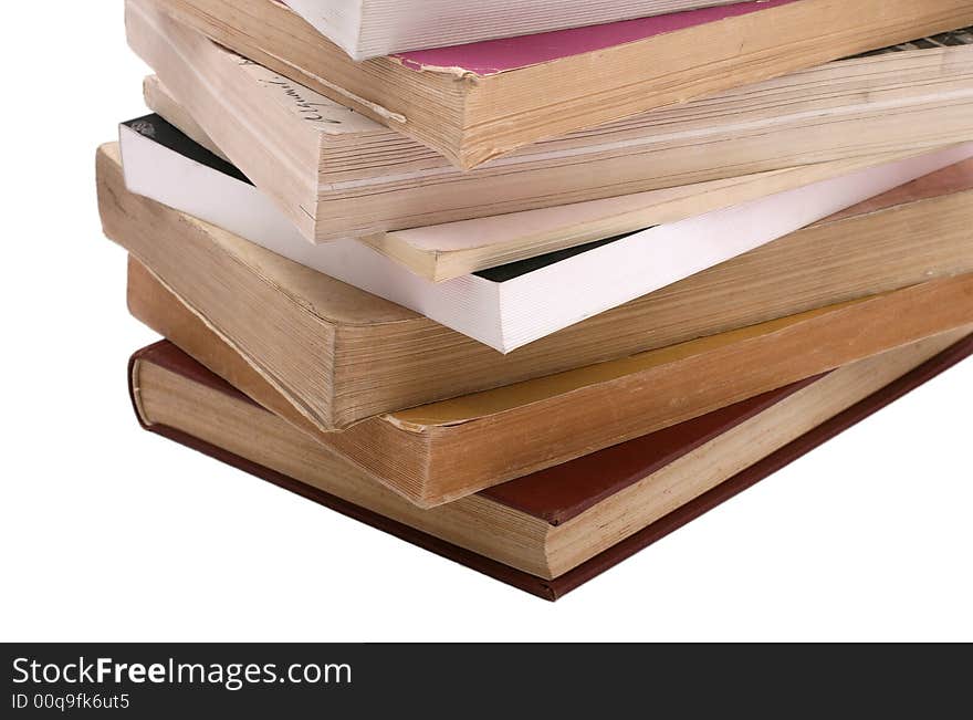 Stack of old books isolated on white