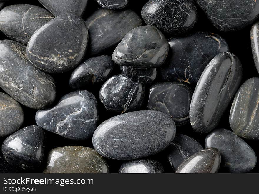 Close up photography of black and grey pebbles