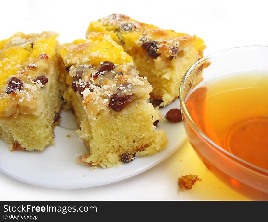 Slice of pie with tea on white background