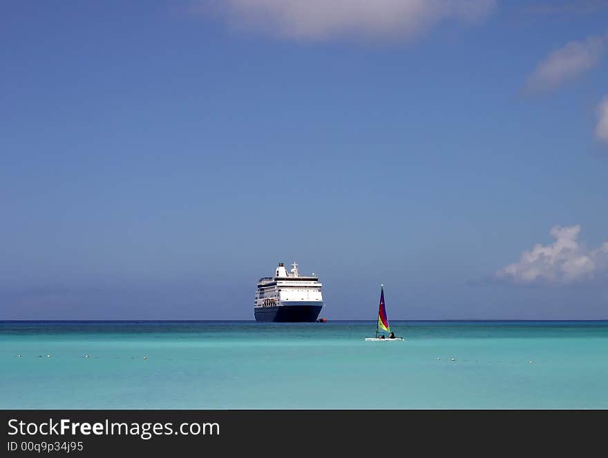 Cruise ship in the Caribbean on a beautiful sunny day. Cruise ship in the Caribbean on a beautiful sunny day.