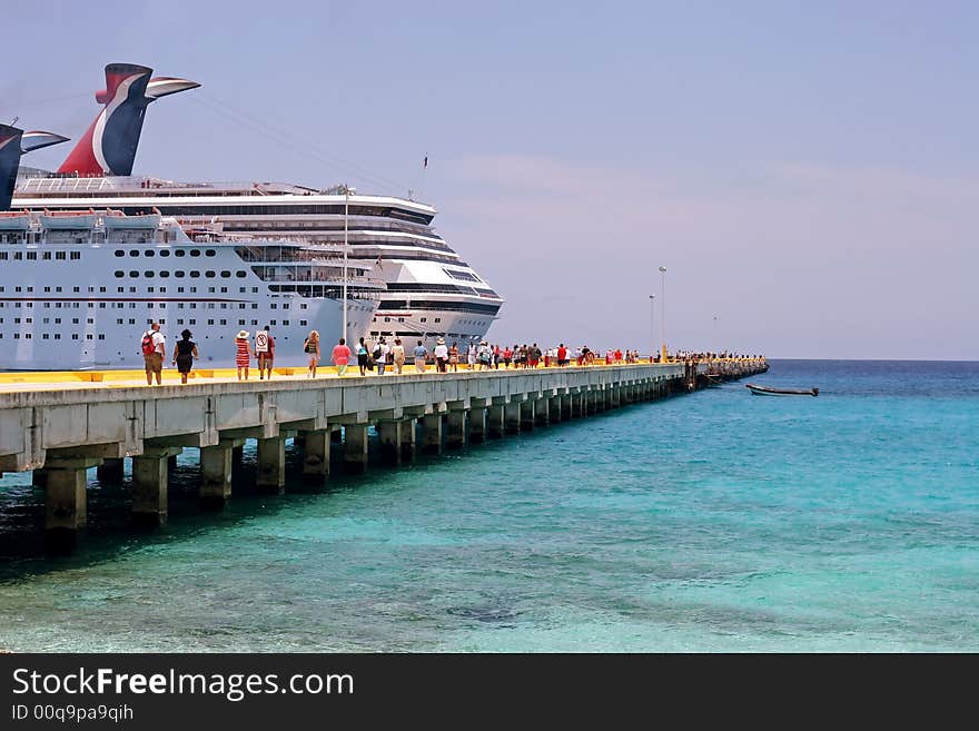 Cruise ship in the Caribbean on a beautiful sunny day. Cruise ship in the Caribbean on a beautiful sunny day.