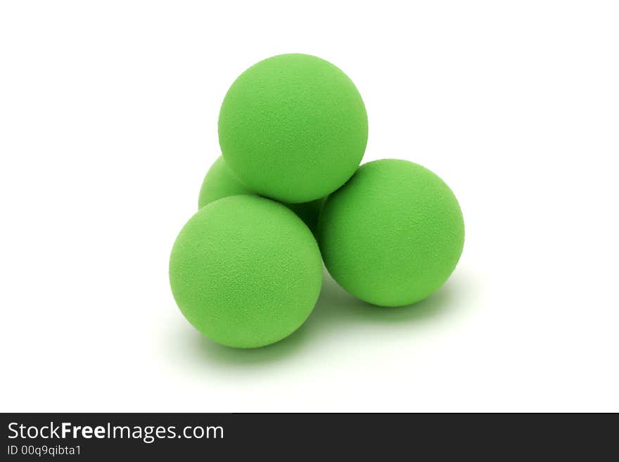 Isolated shot of four green balls. Isolated shot of four green balls.