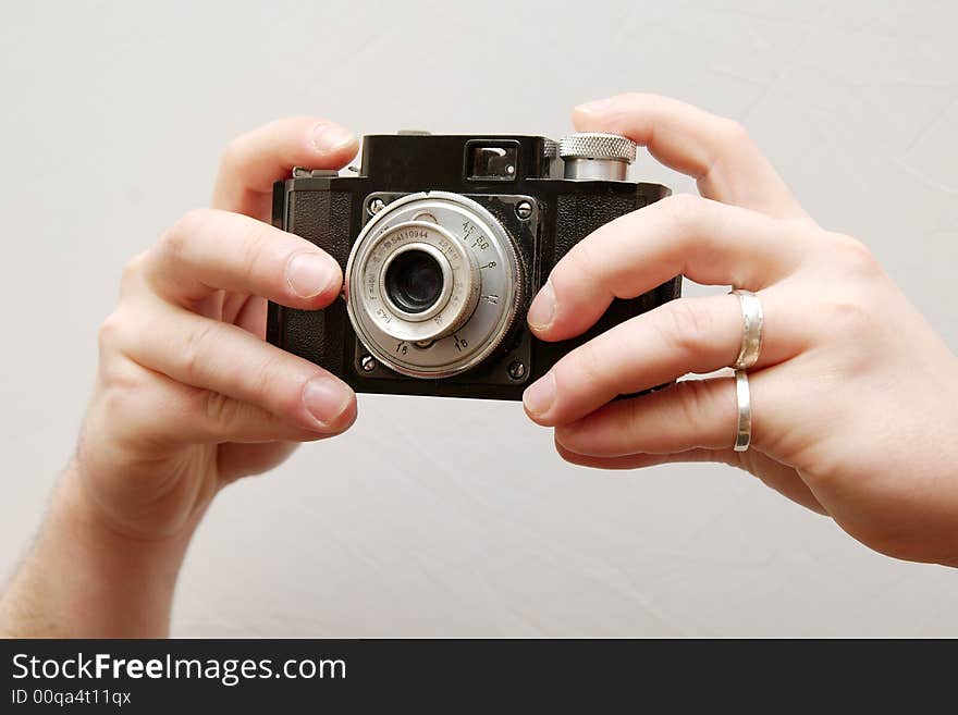 Hands Holding An Old Camera