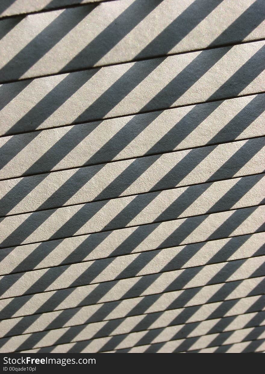 Shadows cast on wooden slats from sunlight. Shadows cast on wooden slats from sunlight