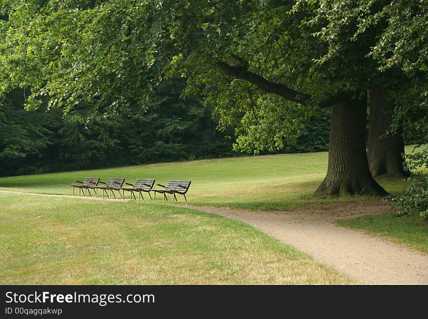 Strip of benches, park of Frederiksborg castle, Hilleroed, Denmark. Strip of benches, park of Frederiksborg castle, Hilleroed, Denmark