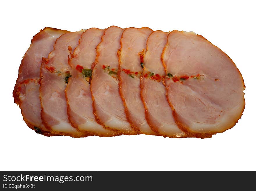 Slices of a ham with spices isolated on a white background