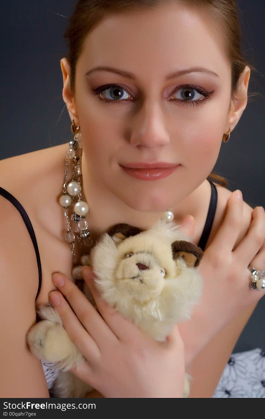 Lovely looking woman portrait holding toy