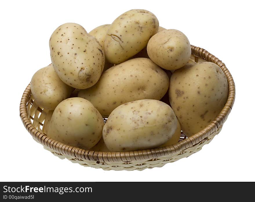 Potatoes on the wicker basket isolated