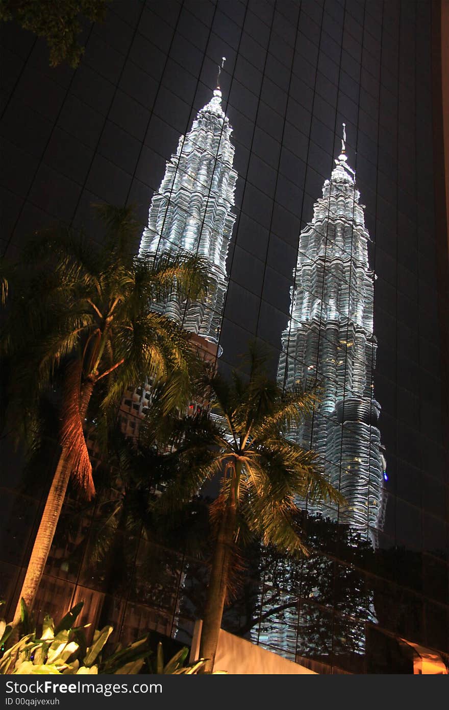 Reflection of skyscraper in Kuala Lumpur at night