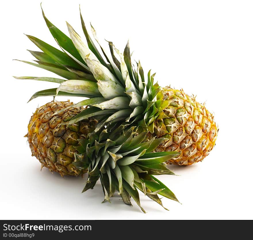 Two pineapples isolated on white background