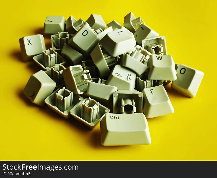 Computer keyboard letters on a yellow background