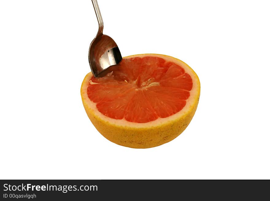 Isolated pink grapefruit half with spoon