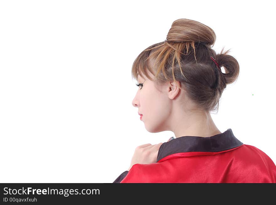 Attractive girl in red kimono stay to turn the head backward. isolated over white. whith copyspace. Attractive girl in red kimono stay to turn the head backward. isolated over white. whith copyspace