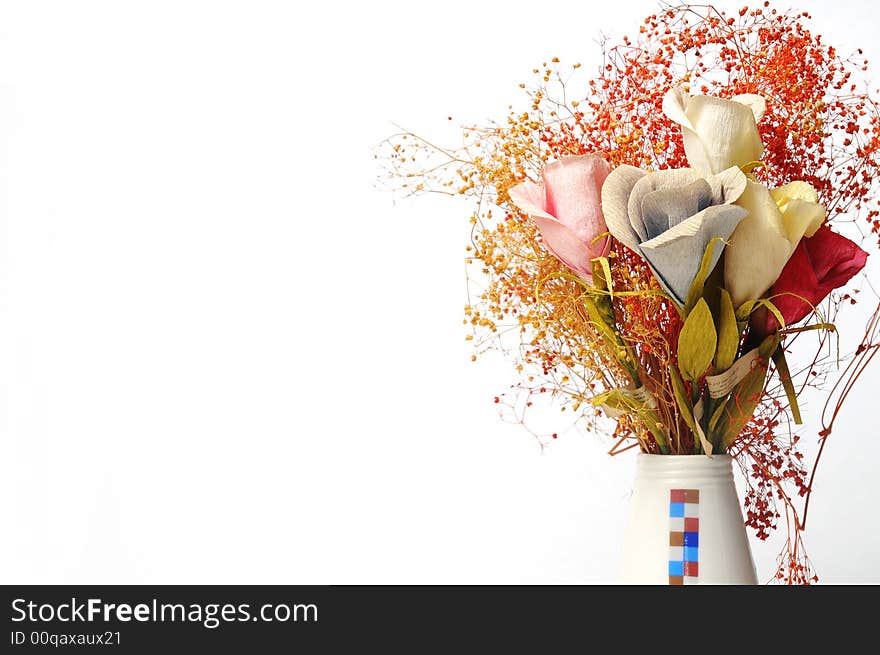 A vase of flowers and white background. A vase of flowers and white background