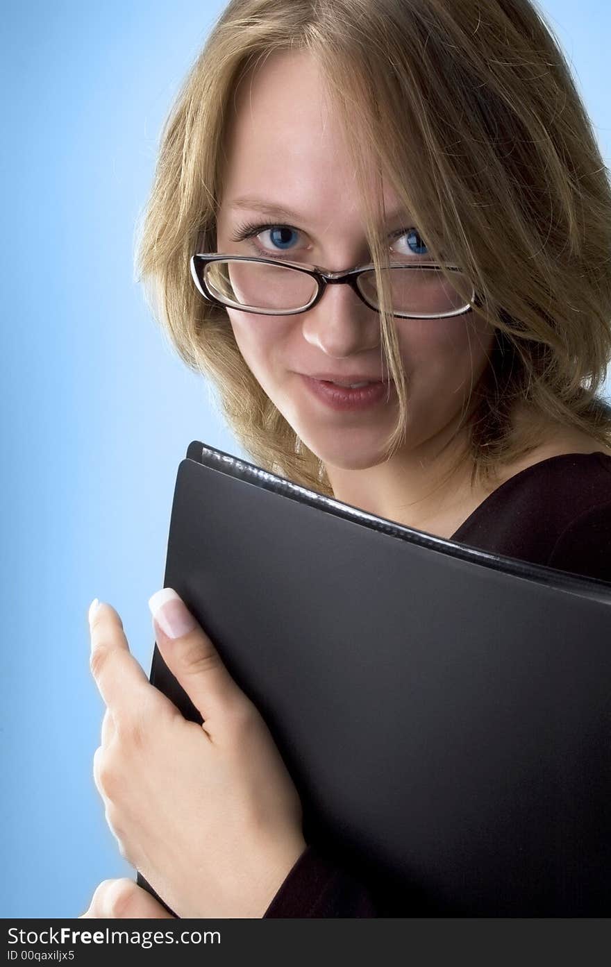 Business woman, portrait on blue