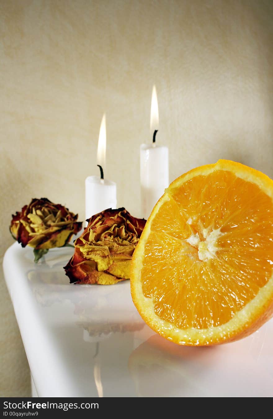 Fresh orange with roses and candlelights for some romance