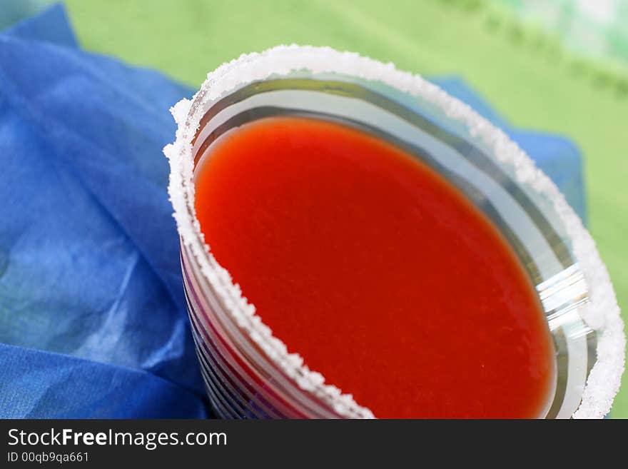 Tomato juice with Worchester sauce and spice served in a salt rimmed glass. Tomato juice with Worchester sauce and spice served in a salt rimmed glass