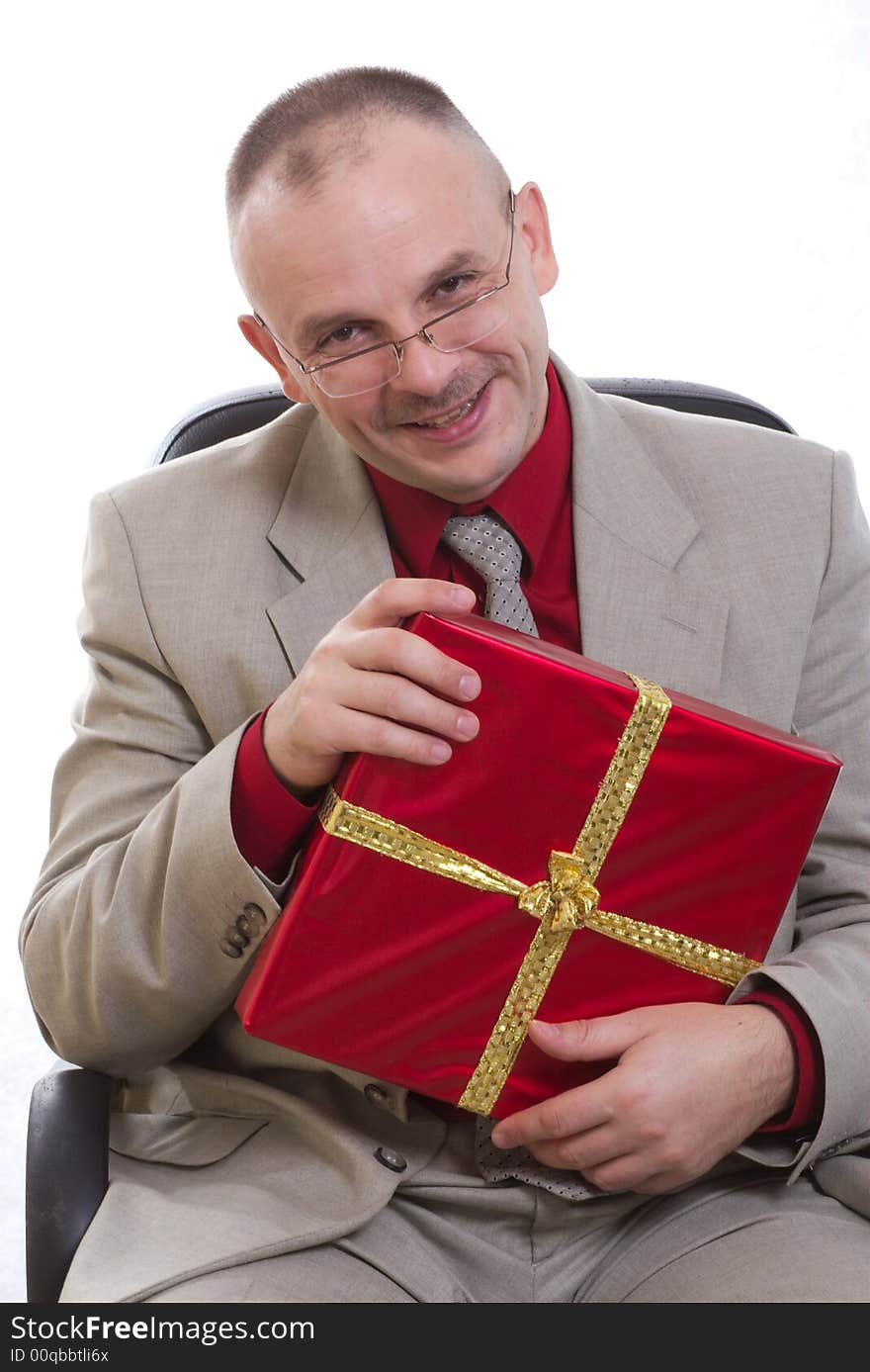 The man holds a gift in hands. The man holds a gift in hands