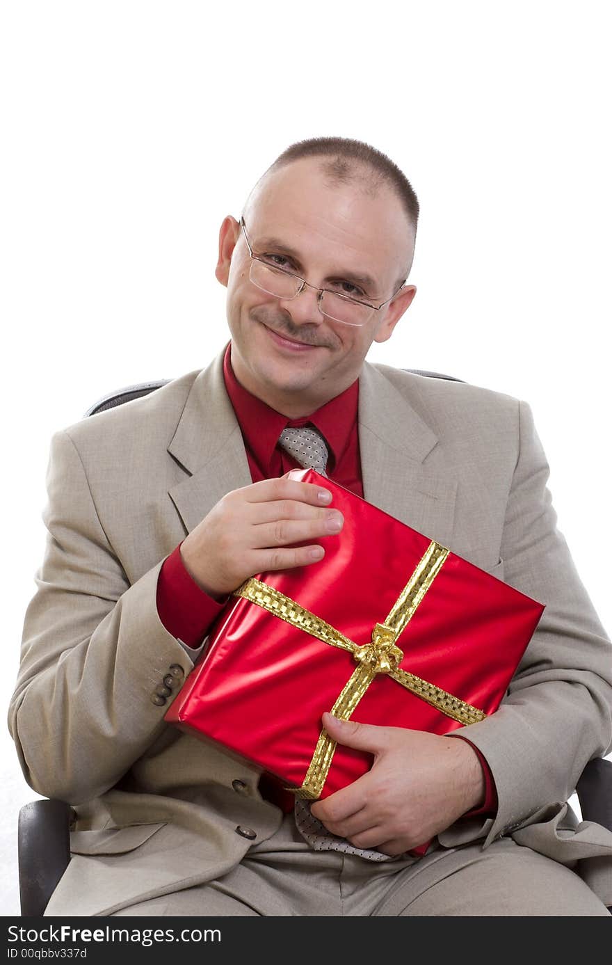 The man holds a gift in hands. The man holds a gift in hands