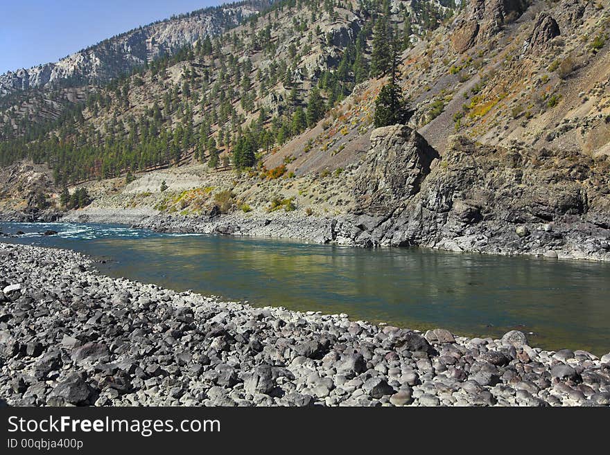 The rather narrow river in mountains of Canada. The rather narrow river in mountains of Canada