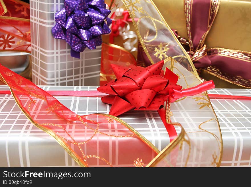 Christmas present on a solid oak table, ribbons and decorations around. Christmas present on a solid oak table, ribbons and decorations around